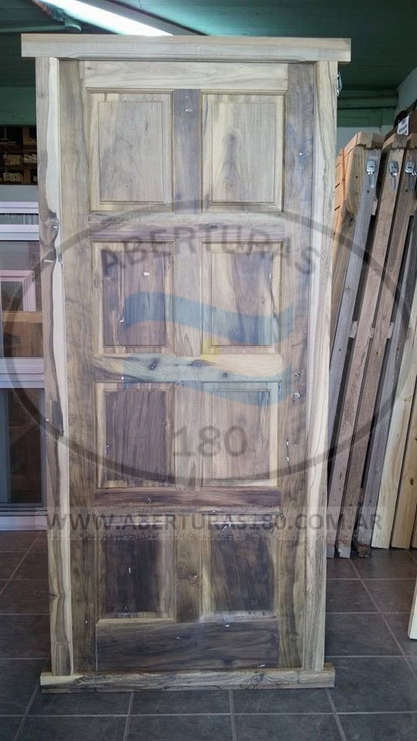 Puerta marco en madera dura, hoja en laurel 0.80 x 2.00 8 tableros.