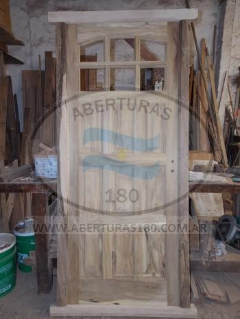 Puerta de 0.80 x 2.00 en Laurel 9 Tab., c/ vidrio espejado y Vent. Lateral c/ Postign.