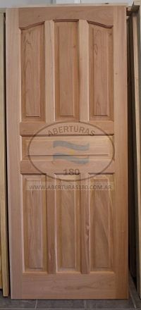 Puerta de entrada c/pao fijo lateral, marco madera dura c/hoja en Cedro machimbre horizontal.